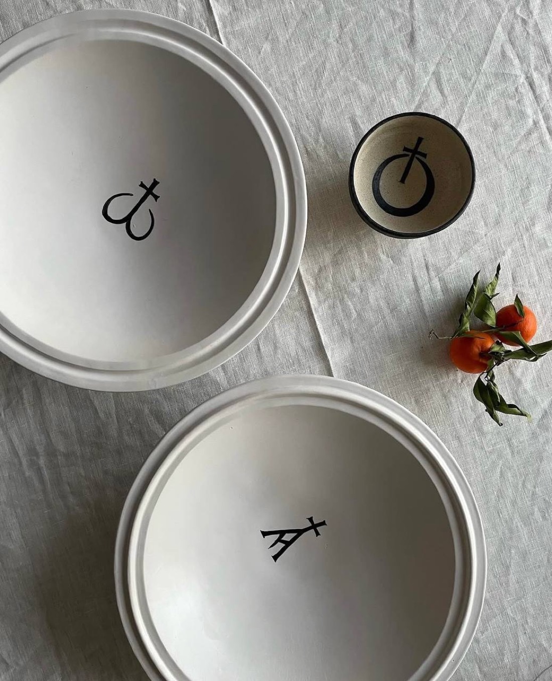 Hand-marked ceramic bowls with mandarins