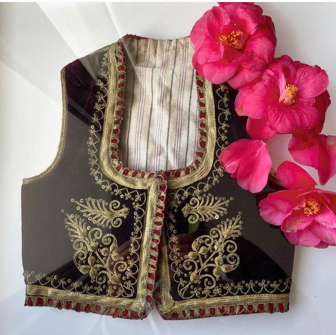 An embroidered velvet waistcoat with camellias